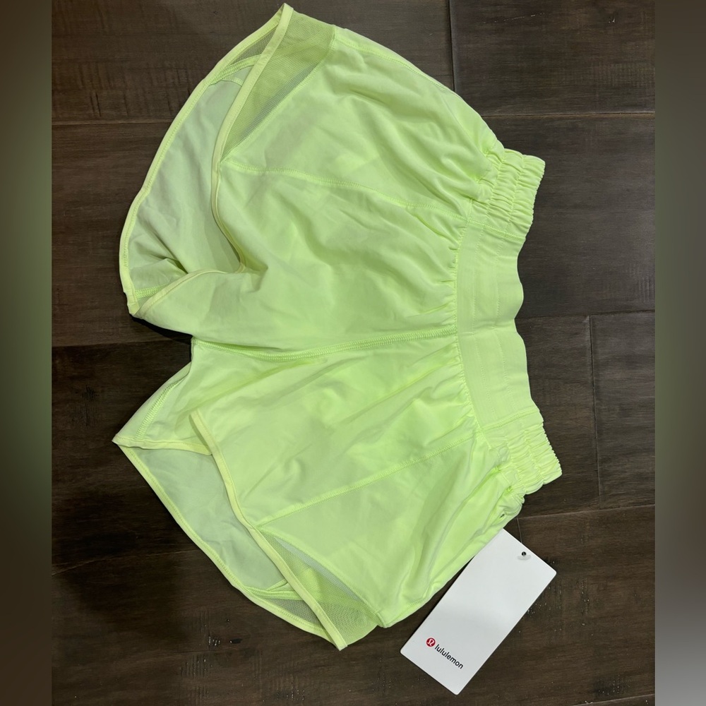 Bright/neon yellow Lululemon Hotty Hot 4” lined shorts. Size 4.
